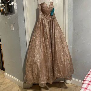 quinceanera dress.only been worn once for photos. rose gold with sparkles.size 8